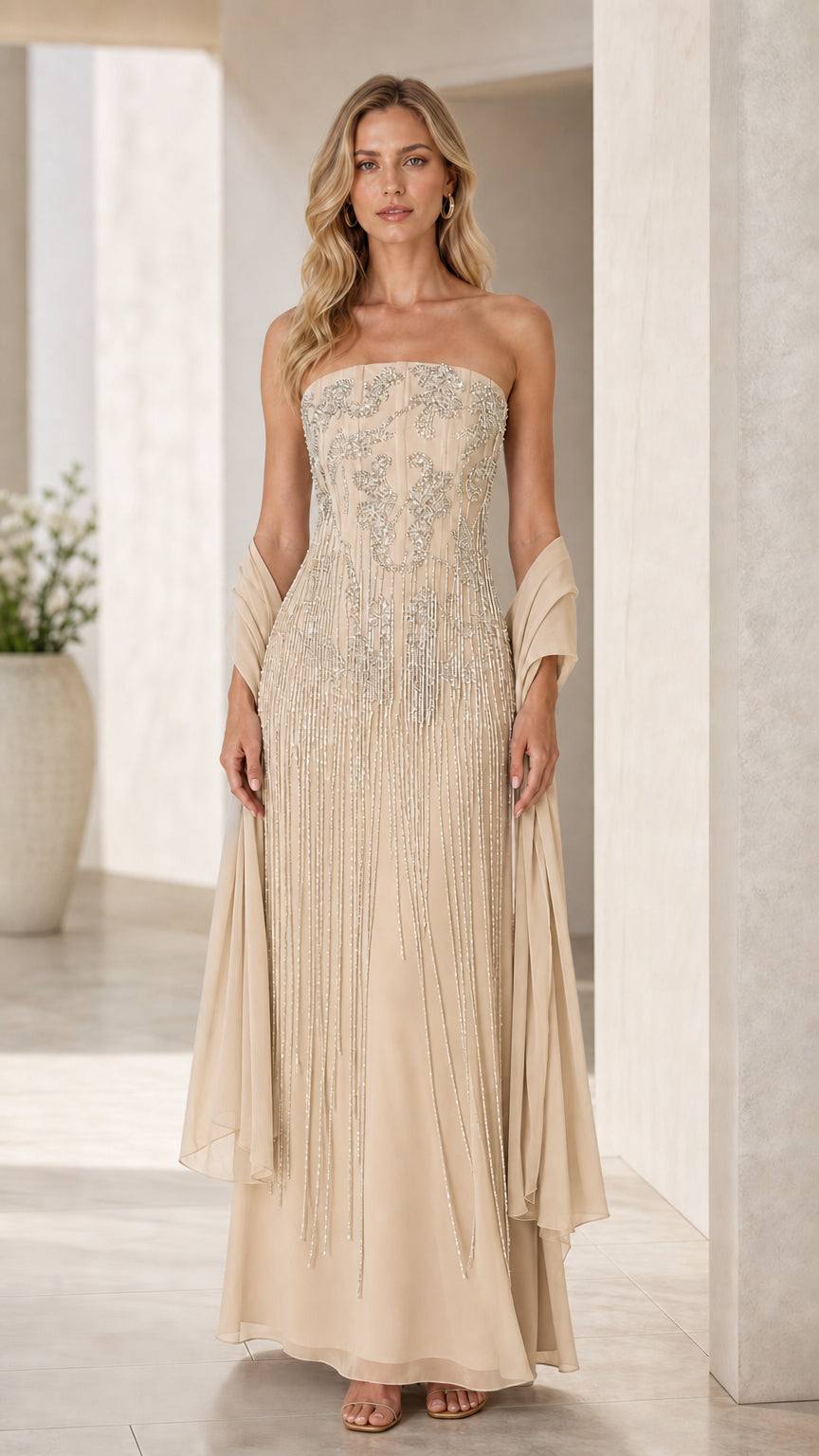 Model wearing champagne gold strapless beaded formal dress with matching shawl