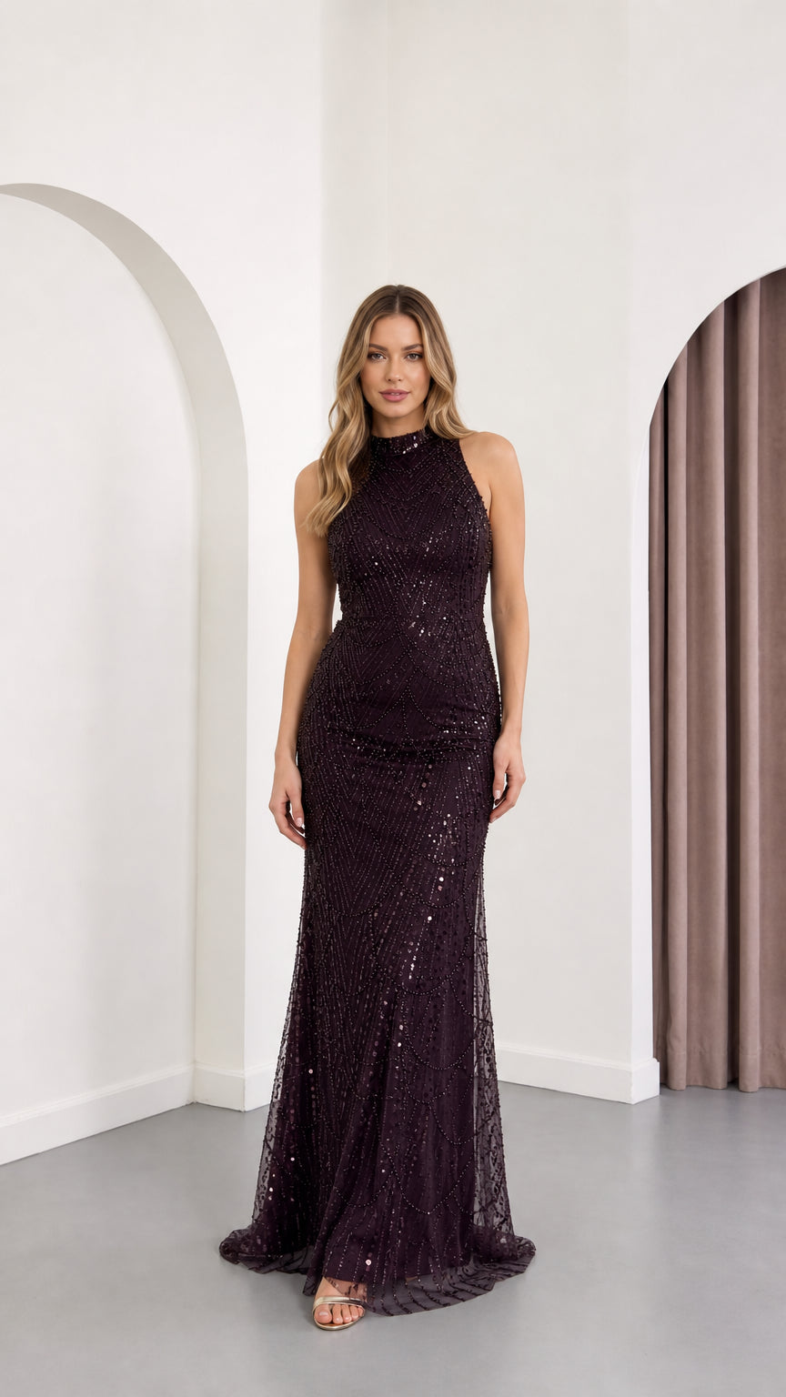 Front view of woman wearing sleeveless high neck sequin maxi evening gown in plum