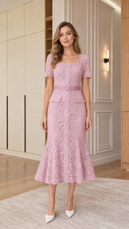 Front view of woman wearing pink square neck lace midi dress with matching belt