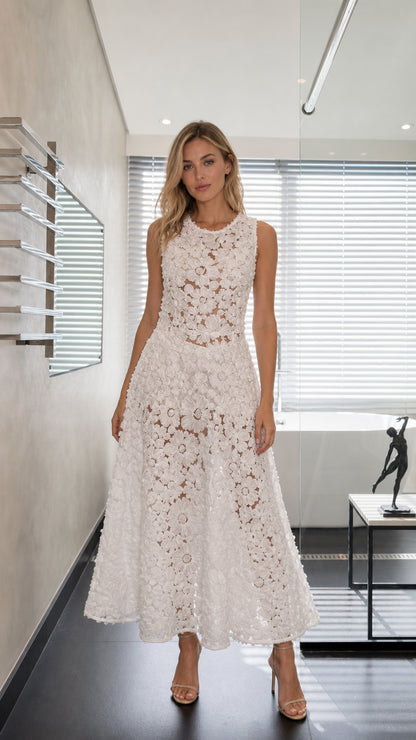 Front view of model wearing white sleeveless 3D floral lace A-line maxi dress