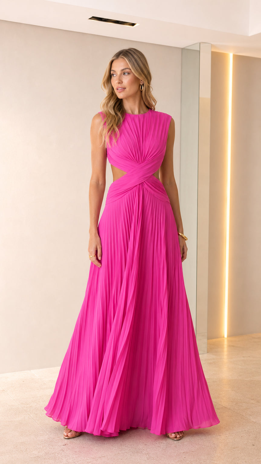 Front view of woman wearing hot pink sleeveless pleated cutout maxi dress