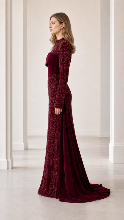 Side profile of burgundy beaded mock neck formal dress with sweeping train