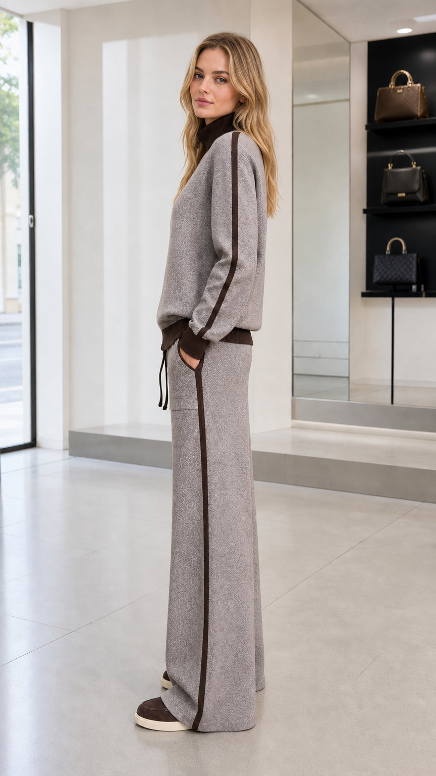 Side profile view of woman wearing Heather Gray knit set showing side stripe detail