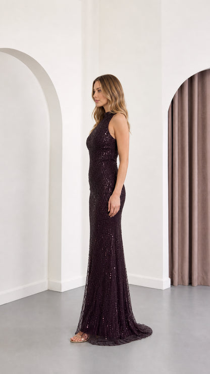 Side profile view of plum sequin high neck floor-length dress