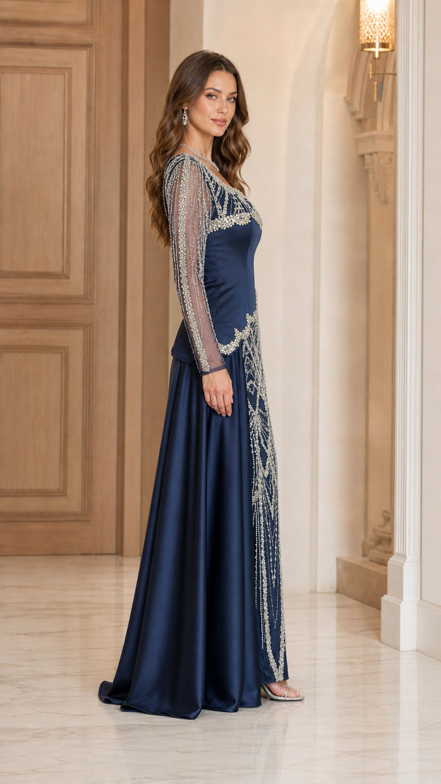 Side profile of Navy Blue embellished evening dress with sheer long sleeves