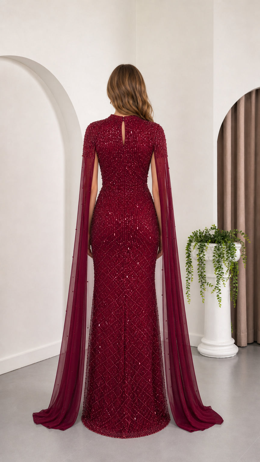 Burgundy floor-length evening gown with cape sleeves, back view