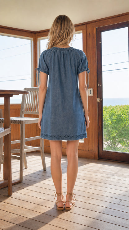 Back view of model wearing Denim Blue embroidered shift mini dress