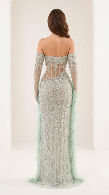 Back view of mint green formal gown with sweep train