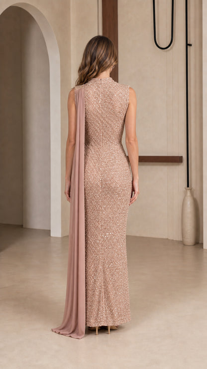 Back view of champagne sequin evening dress with shoulder capelet