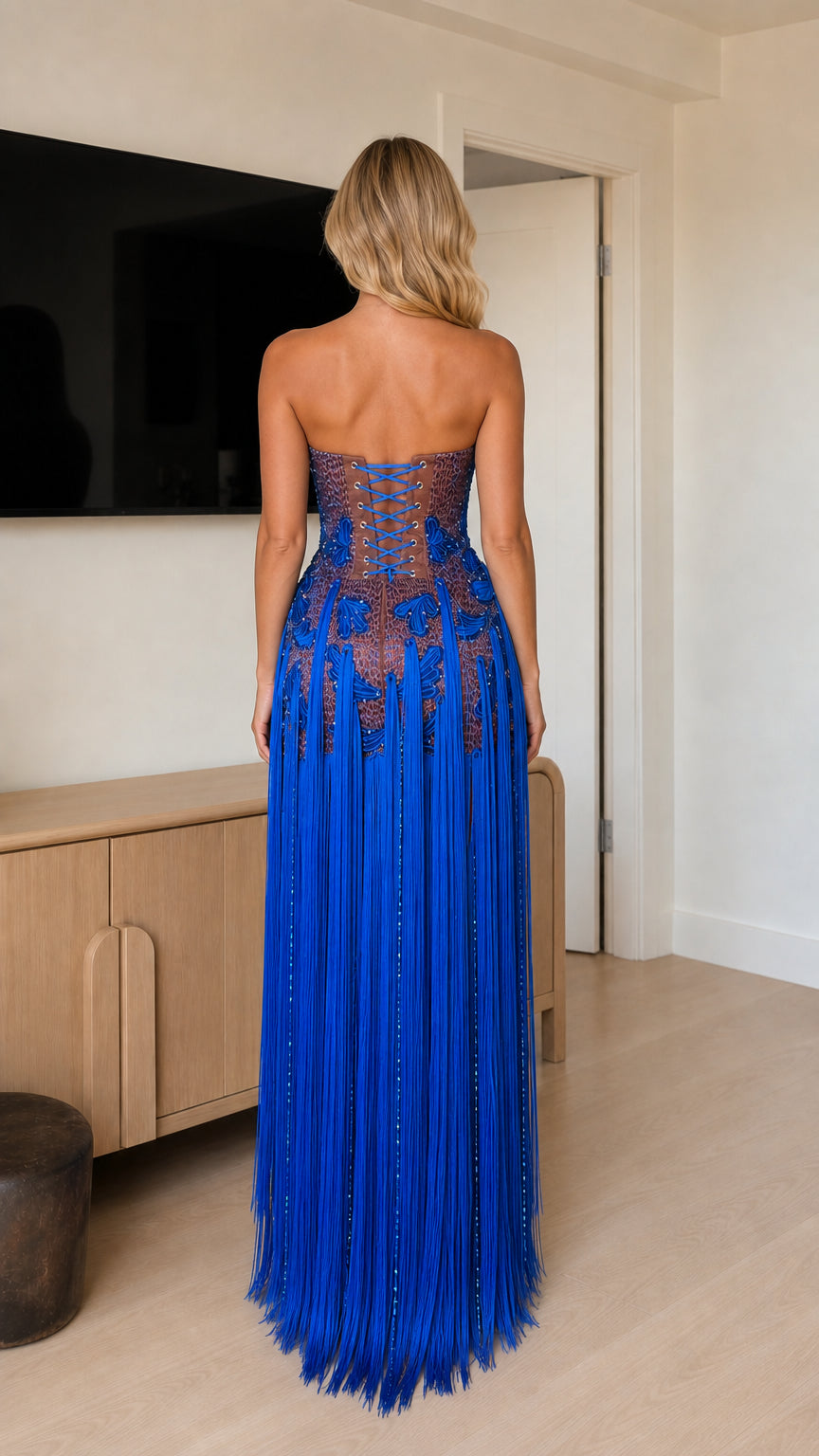 Back view of model in Royal Blue strapless fringe tassel evening dress