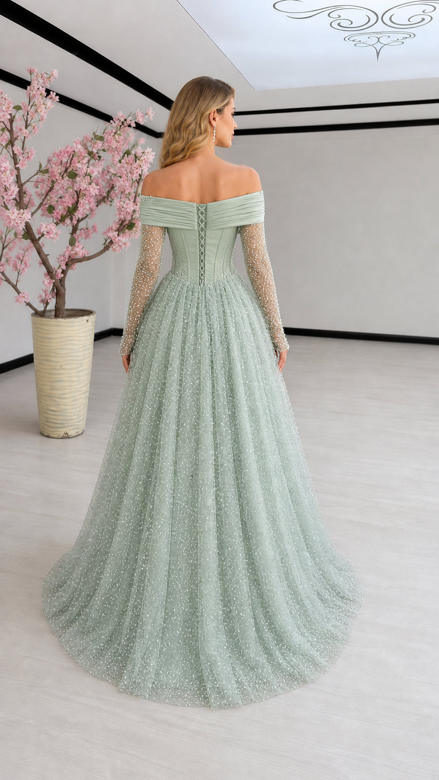 Back view of Sage Green evening gown showing lace-up corset and flowing tulle skirt