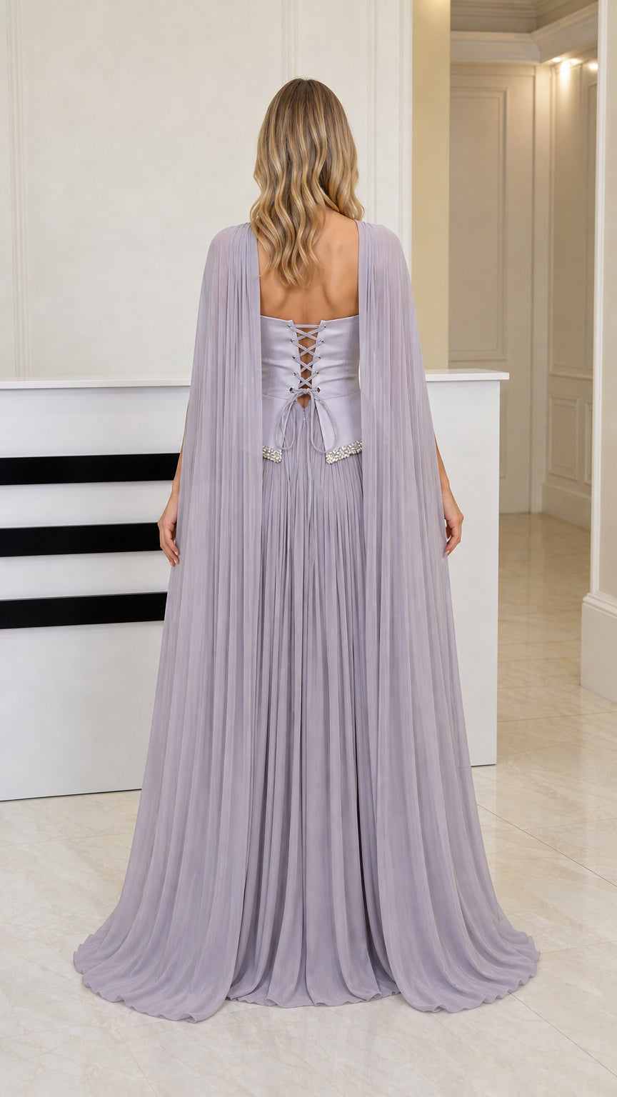 Back view of dusty lilac evening gown highlighting corset lace-up closure and cascading cape