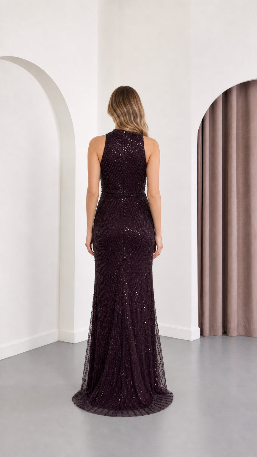 Back view of plum sleeveless high neck sequin formal gown