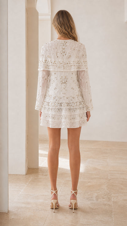 Back view of white sequin and beaded mini dress with long sleeves