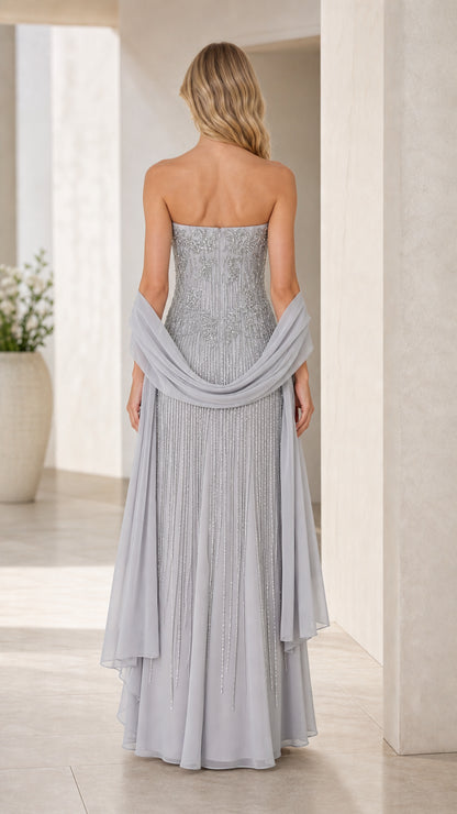 Back view of dusty blue strapless embroidered floor-length gown and shawl