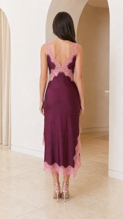 Back view of burgundy satin midi dress highlighting deep V-back with lace trim