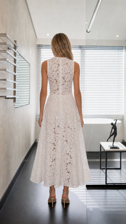 Back view of model in white floral lace A-line dress showing back zipper closure