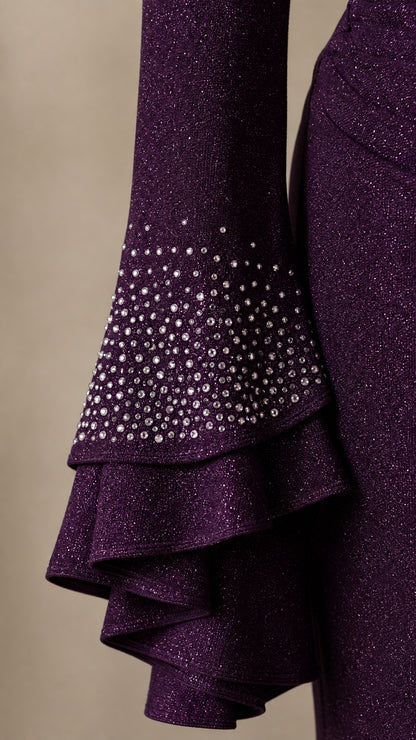 Detailed close-up of multi-tiered ruffle sleeve cuff with scattered rhinestone embellishments