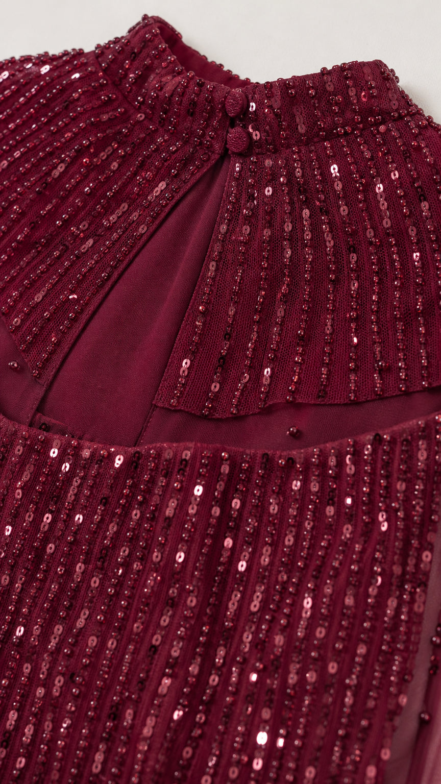 Close-up of burgundy sequin embellishment and neckline detail