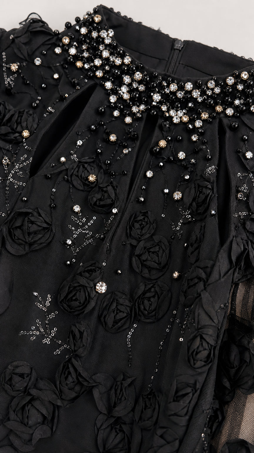 Close-up detail of black 3D floral lace bodice with crystal beading
