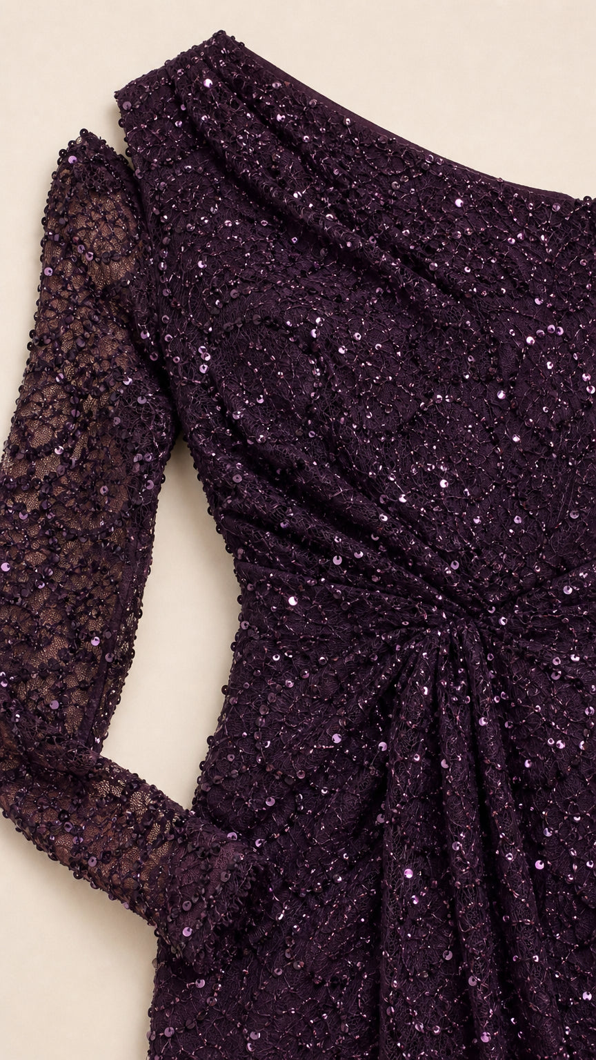 Close-up detail of plum sequined lace fabric and gathered waist
