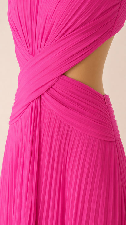 Close-up of waist cutout and criss-cross pleated detailing on hot pink gown
