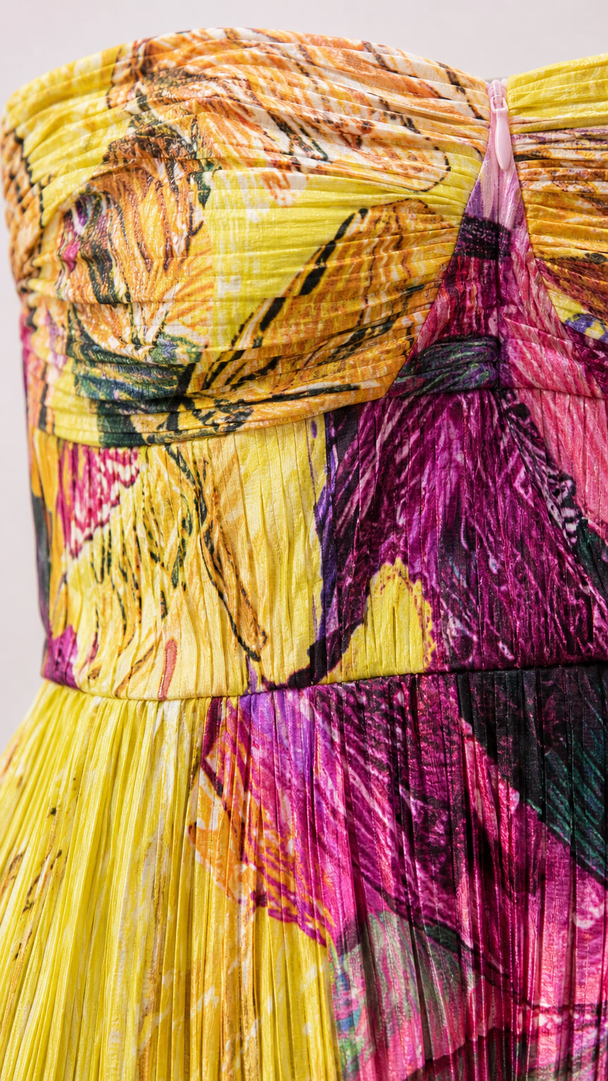 Close-up detail of textured pleating and bodice on abstract print dress