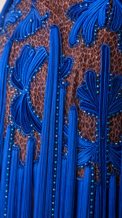 Close-up detail of Royal Blue cord embroidery, bead accents, and tassel fringe