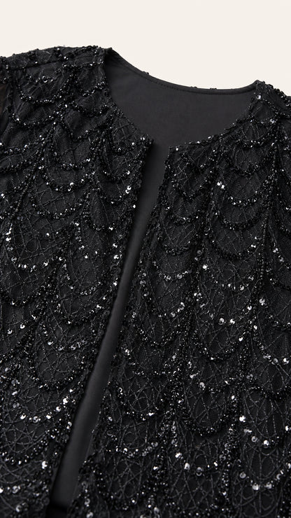 Close-up detail of black scalloped sequin embroidered jacket texture