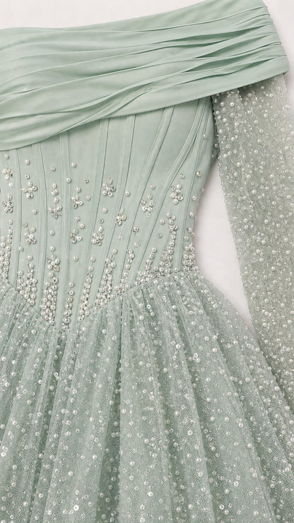 Close-up detail of pleated neckline, corset boning, and intricate beadwork
