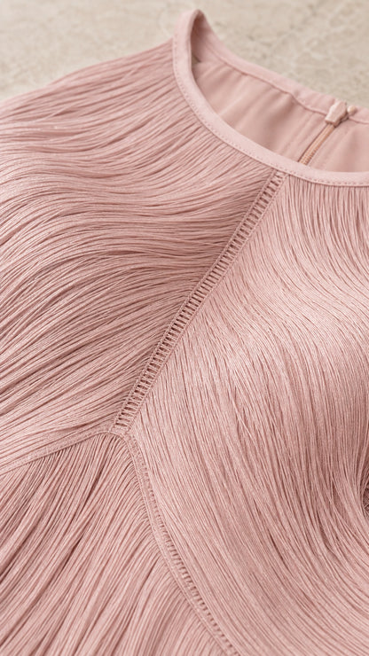 Close-up detail of blush pink high neckline and chevron fringe stitching