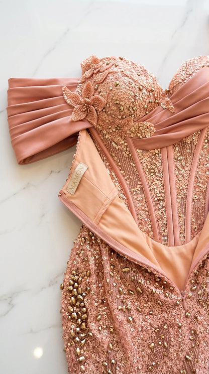 Close-up detail of structured corset boning, floral applique, and sequin embellishments