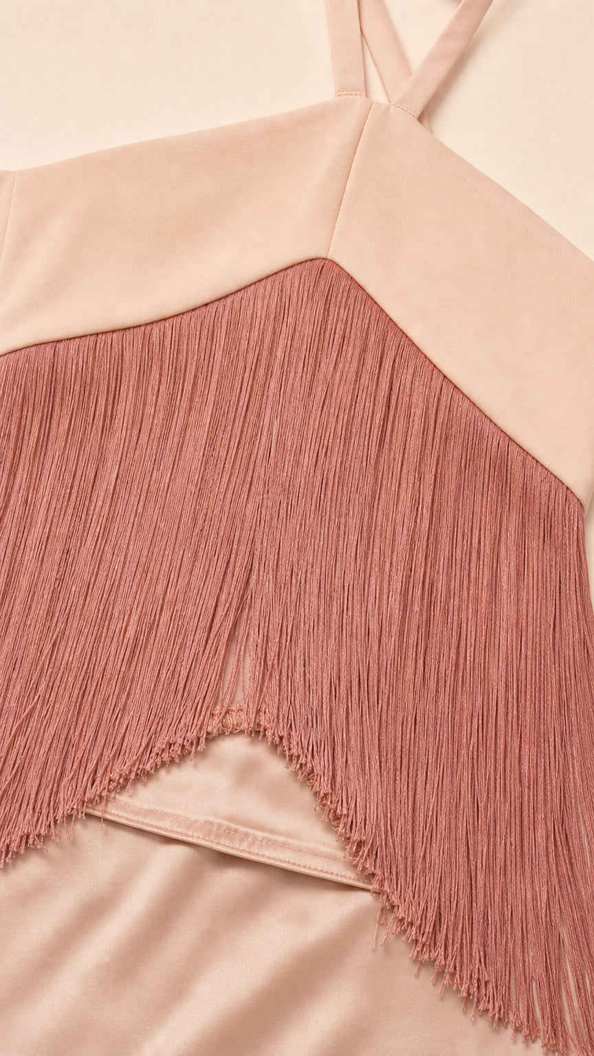 Close-up detail of smooth satin fabric and delicate chevron fringe trim