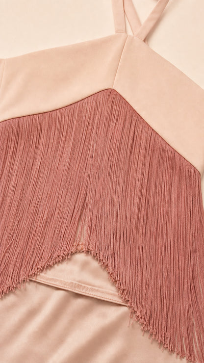 Close-up detail of smooth satin fabric and delicate chevron fringe trim