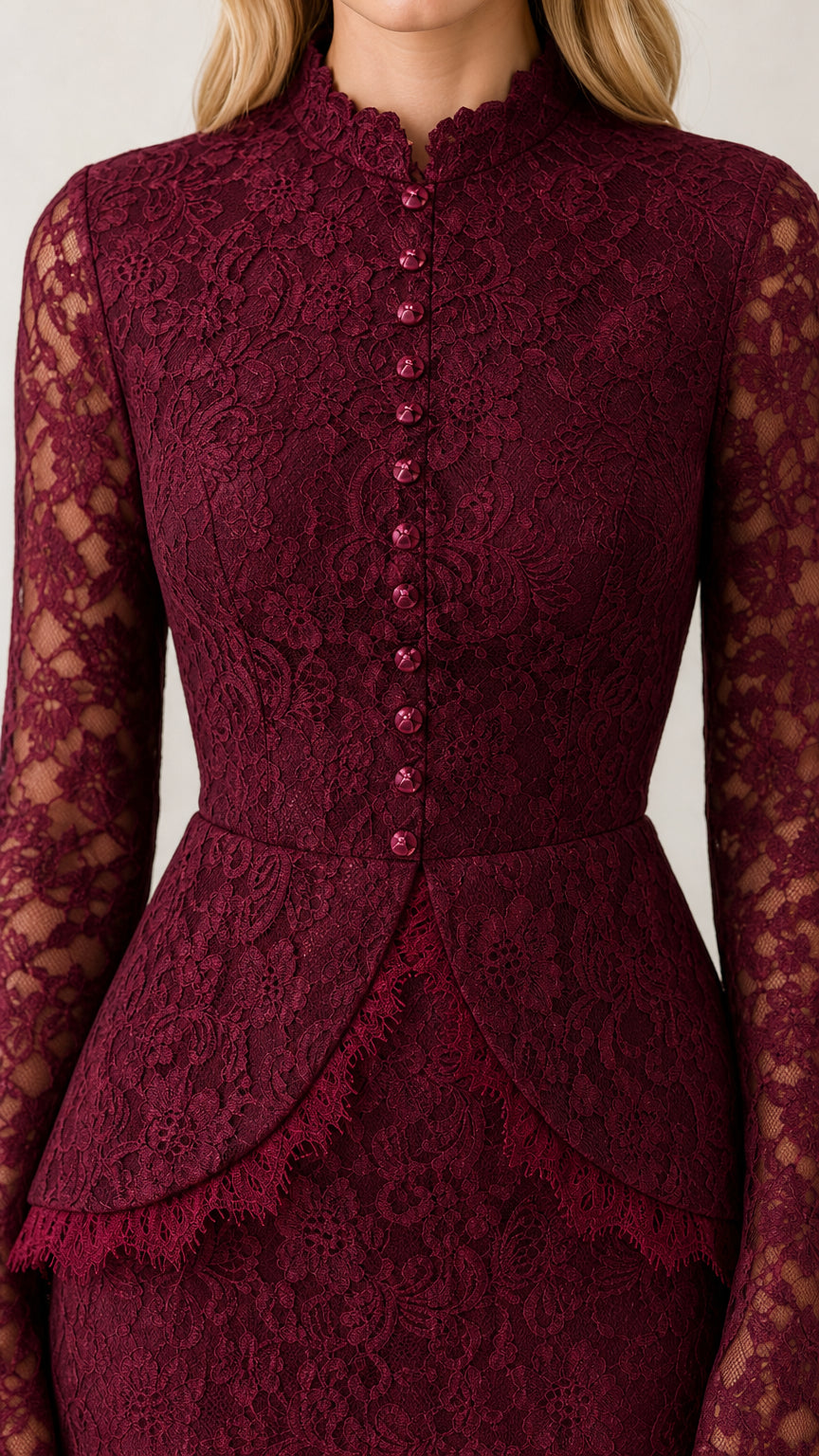 Close up view of burgundy button front lace bodice and peplum detail