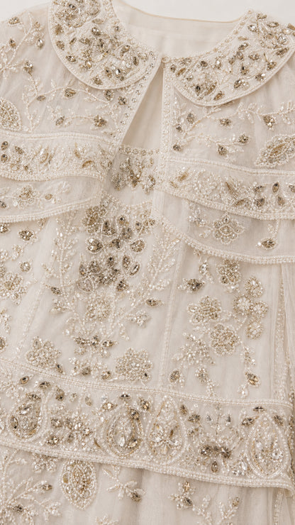 Close-up detail of intricate floral beadwork and sequin embellishments
