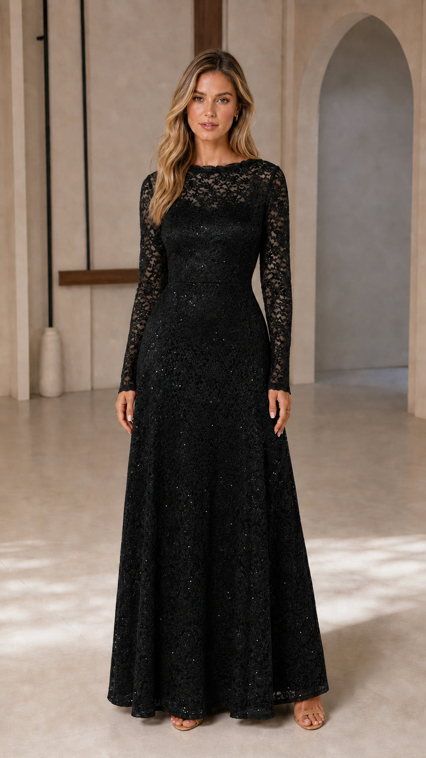 Front view of model wearing black long-sleeve lace gown