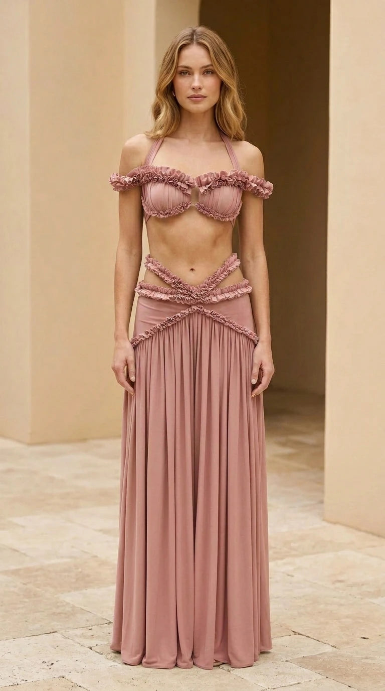 Model wearing dusty rose ruffled halter two-piece maxi skirt set