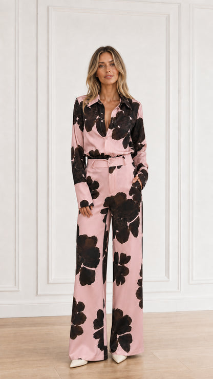 Full-length view of floral print two-piece shirt and pant set in blush pink
