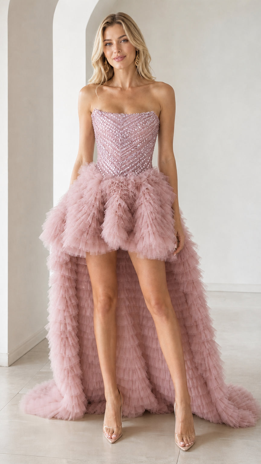 Front view of pink color variant with high-low ruffled train