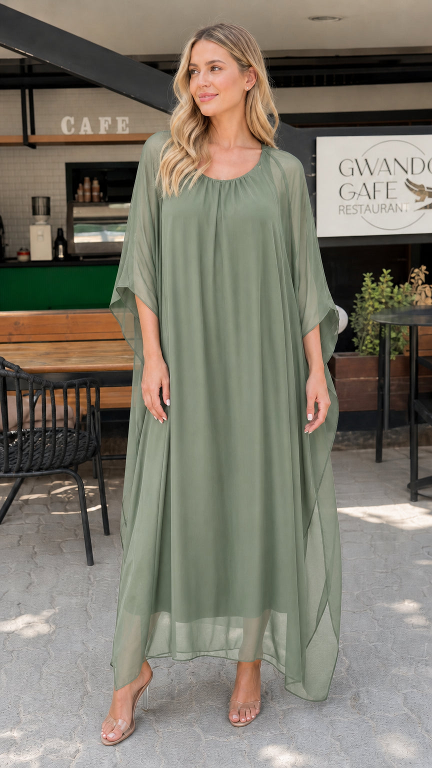 Model wearing sage green chiffon kaftan maxi dress