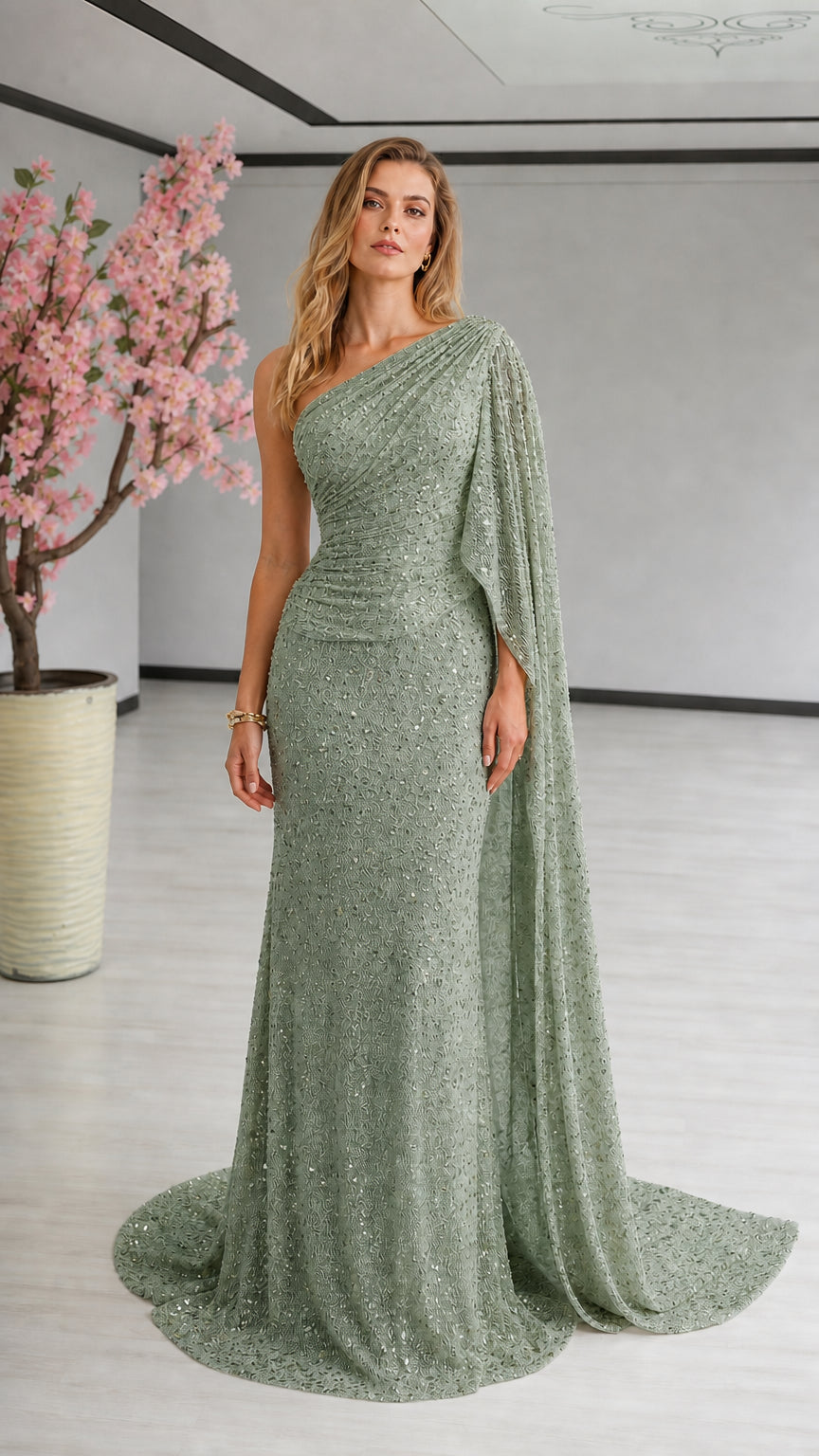 Sage green one-shoulder sequin gala gown with cape sleeve and train