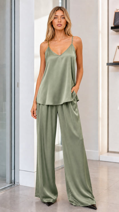 Model wearing sage green satin camisole and matching wide leg trousers