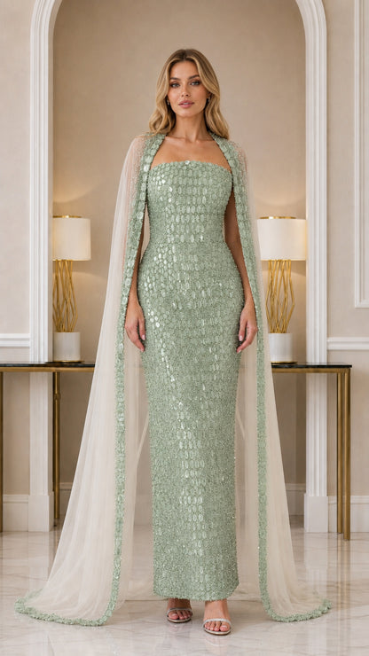 Model wearing Sage Green strapless column gown with beaded trim cape
