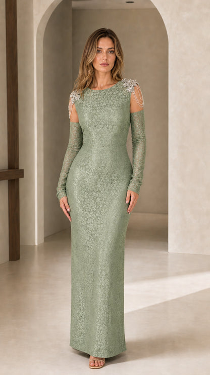 Full-length view of model wearing sage green column evening dress with crystal shoulder accents