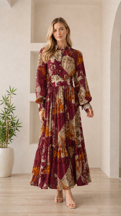 Woman wearing burgundy floral long sleeve maxi dress
