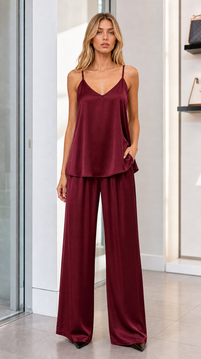 Model wearing burgundy wine satin cami and wide leg pants matching set