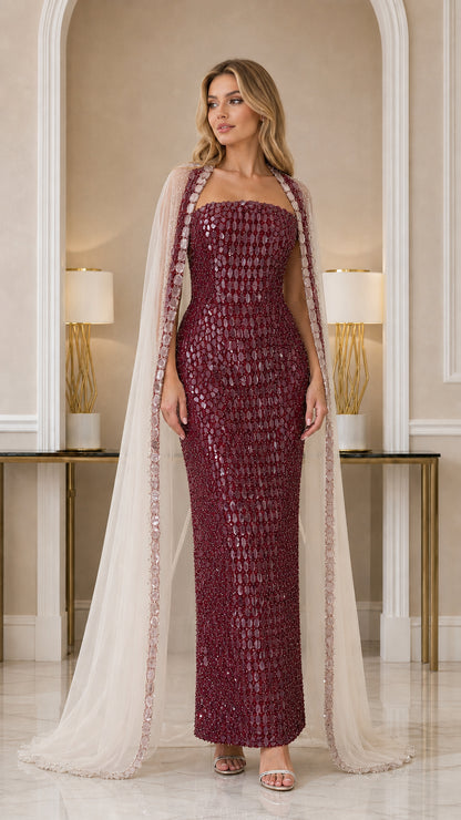 Model wearing Burgundy embellished column evening gown with cape