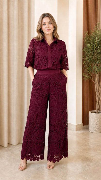 Front view of model wearing burgundy lace matching set