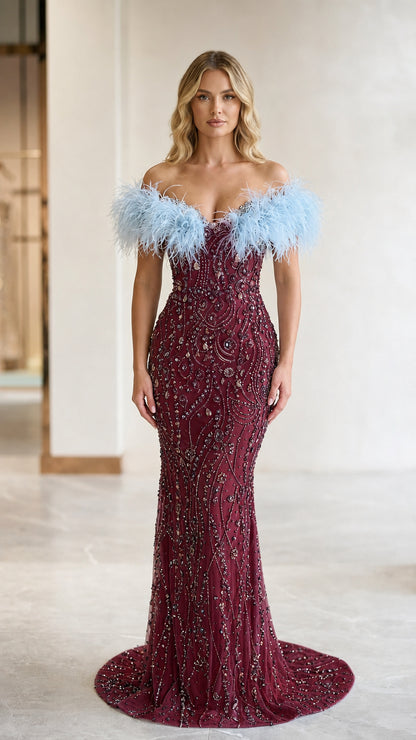 Burgundy beaded formal dress accented with light blue feather trim